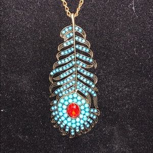Beaded turquoise peacock tail with red inlay